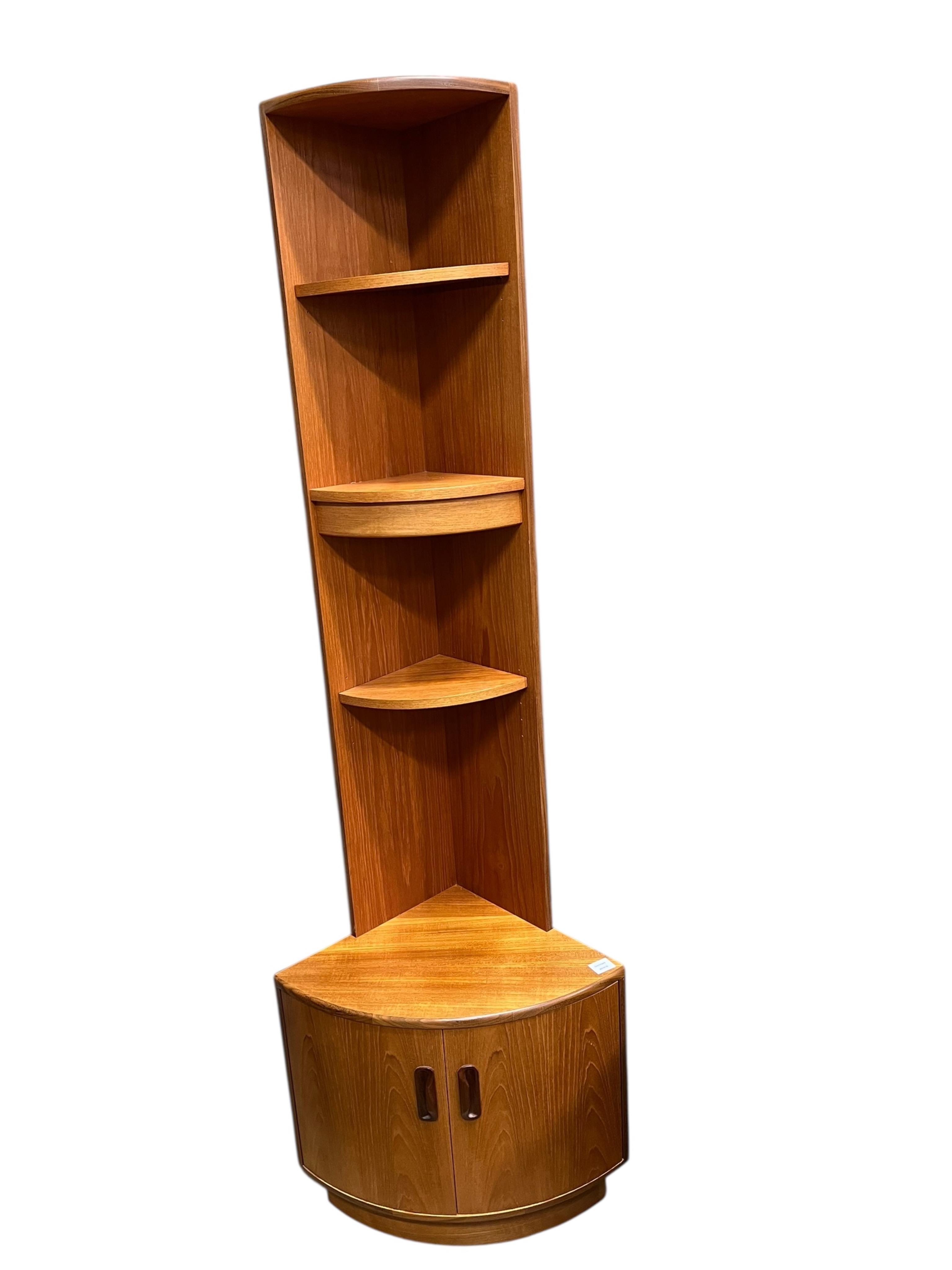 A mid century teak standing corner cabinet, width 63cm, depth 43cm, height 198cm